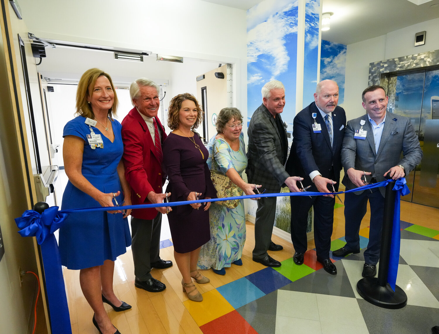 Baptist Health and Wolfson Children's Hospital leaders with members of THE PLAYERS Championship Village Board cut the ribbon on the new unit.